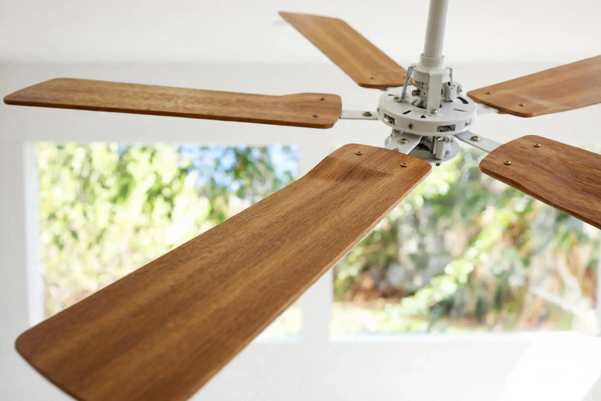 Ceiling Fan Size: How to Pick One That Actually Moves Air 5 Close-up of ceiling fan blades showing their angled blade pitch
